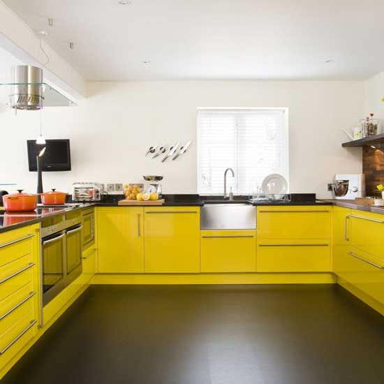a modern yellow and black kitchen is sure to raise your mood with its contrasting colors