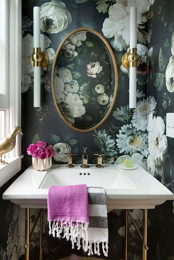 moody realistic floral wallpaper create a chic vintage space and gilded accents add to it