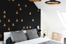 08 a Scandi space with a mid-century modern feel and a black wall with a gold tirangle print