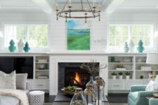 08 a neutral farmhouse space with a built-in fireplace and some aqua-colored touches