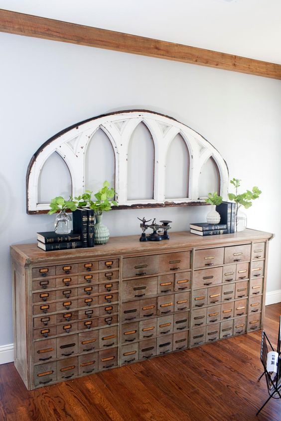 a vintage wooden apothecary cabinet as a gorgeous console table