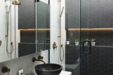 08 black hexagon tiles on the wall and floor in the shower to make the shower stand out