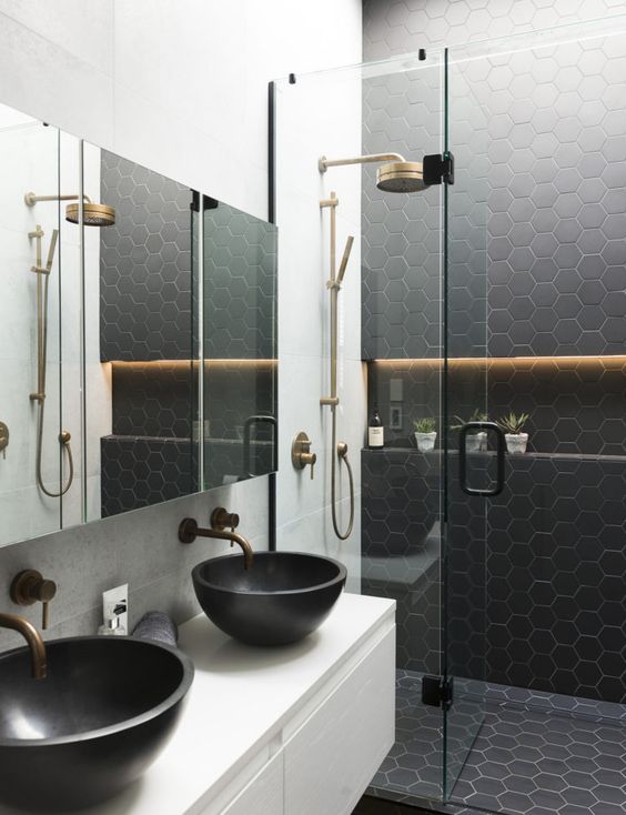 black hexagon tiles on the wall and floor in the shower to make the shower stand out