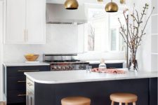 09 a graphite grey and white kitchen is made more glam with brass lamps and handles