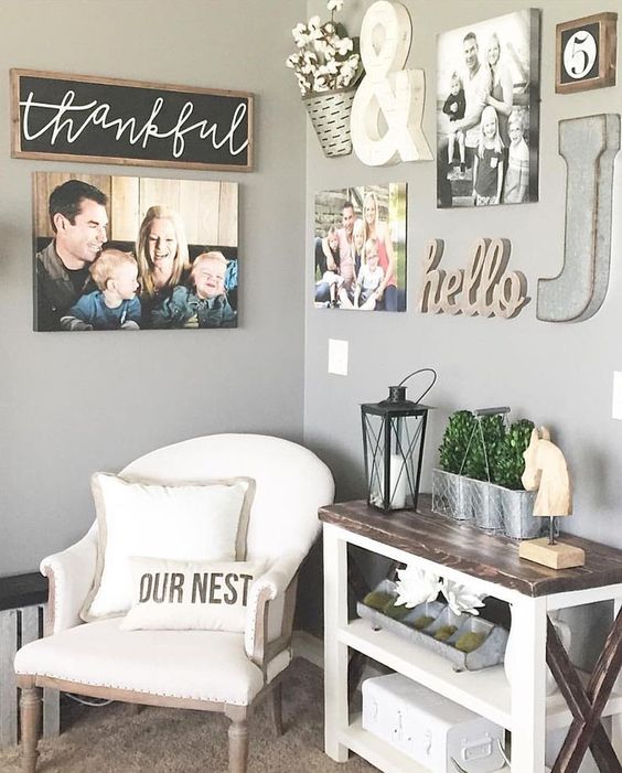 a small nook with a comfy chair, a console table and family photos and signs all over