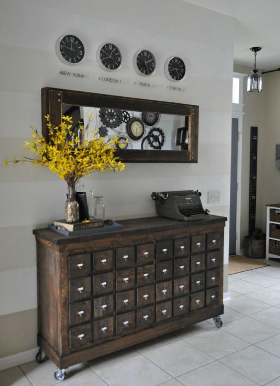 a vintage apothecary cabinet on casters as a stunning antique entryway console
