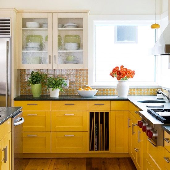  farmhouse space with sunny yellow cabinets and a gorgeous printed yellow tile backsplash to match