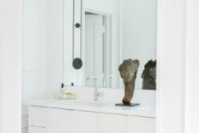 10 The master bathroom is sleek, modern and white, nothing unnecessary here