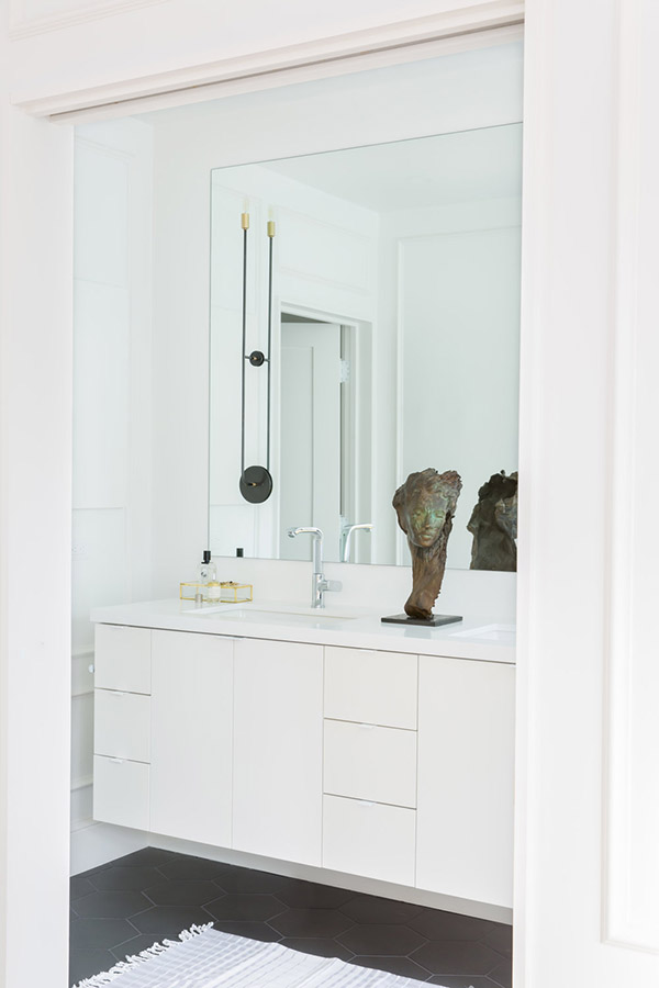 The master bathroom is sleek, modern and white, nothing unnecessary here