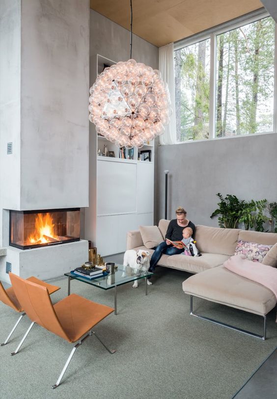 this modern built in fireplace is like a sculptural element in the living room