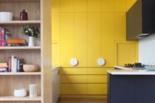 11 a minimalist bold yellow kitchen, with a navy and white kitchen island for a contrasting touch