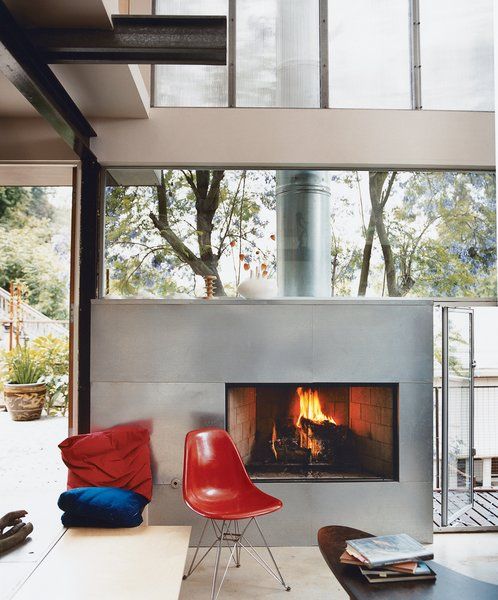 a fireplace clad with galvanized steel for a modern space looks lightwieght and chic