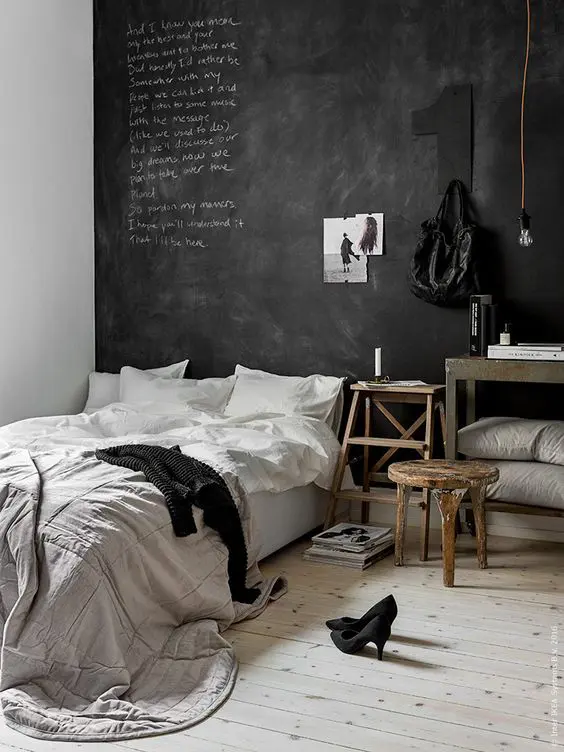 a Scandinavian space with a chalkboard headboard wall for a creative dialogue between the members of the family and some art