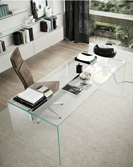 a clear glass desk looks very chic and eye-catchy, and though it doesn't have storage drawers, it's very stylish