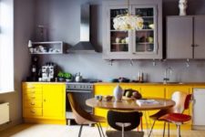 13 a gorgeous grey lavender moody kitchen with bold yellow cabinets to contrast and enliven the space