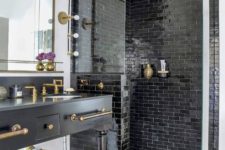 13 a vintage-inspired matte black vanity with brass fixtures with vintage legs and other brass touches to tying the parts