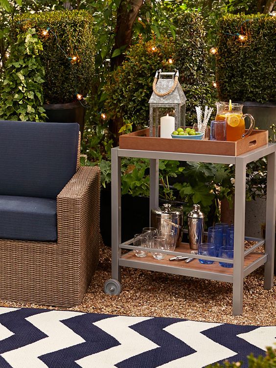 a bar cart can be placed in your patio or garden to use it as an outdoor bar