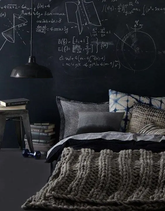a manly space with a platform bed, a vintage lamp and a chalkboard wall for creativity and thoughts