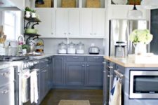16 a framhouse-styled kitchen with grey and white cabinets, wicker touches and vintage lamps