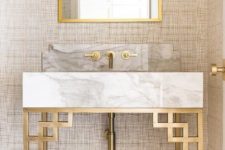 16 a marble and brass bathroom vanity with geometric decor and fixtures looks gorgeous