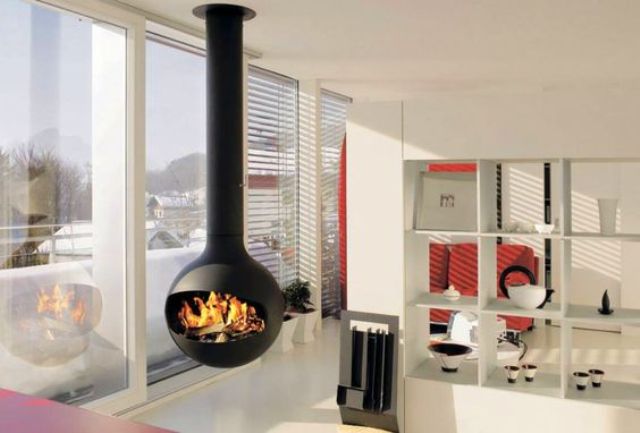 a modern space is spruced up with a hanging fireplace looks gorgeous