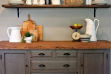 16 stained wooden shelves and a matching countertop for a farmhouse kitchen nook