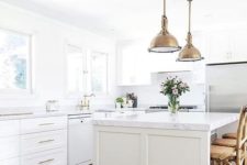 17 a farmhouse kitchen with brass vintage touches and marble countertops for an eye-catchy touch