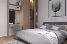 17 a modern bedroom in white and light grey, wooden floors and a wooden wall item with a wardrobe and desk