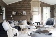 18 a Scandinavian space is made warmer and cozier with wooden walls in a natural finish
