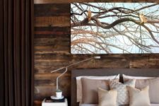 18 a stylish modern bedroom in shades of brown is added interest with a reclaimed wood wall
