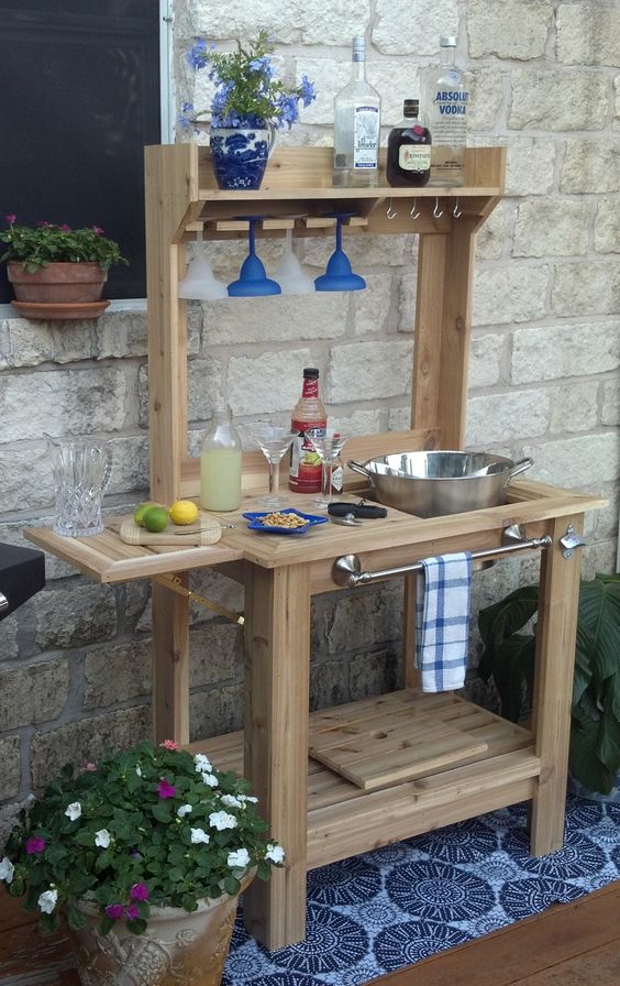 a custom-made wooden bar stand for a rustic patio provides comfort in using
