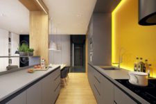 20 a minimalist matte grey kitchen with a yellow backsplash with additional lighting