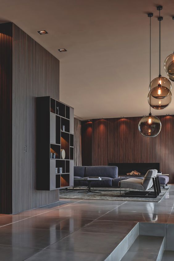 a stylish modern living room with a stained wooden wall with a fireplace that brigns texture in
