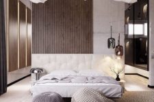 22 a concrete and wood slat wall, an upholstered refined creamy bed and knit items make the bedroom very inviting