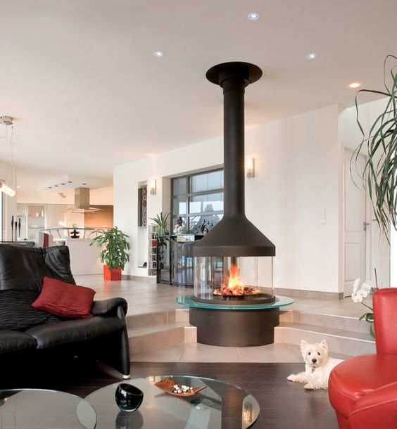 a modern glass fireplace is a stunning feature for the whole open space
