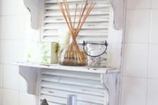 22 a white shutter is a nice base for a bathroom shelf and is very functional piece