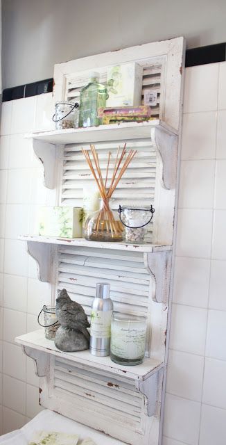 a white shutter is a nice base for a bathroom shelf and is very functional piece