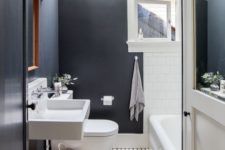 22 black walls and white tiles contrast and make a cool and eye-catchy space