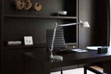 23 a moody home office with black walls, furniture and curtains looks masculine and gorgeous