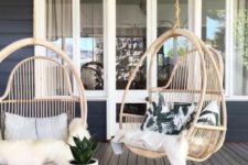 23 hanging rattan chairs with pillows and faux fur to feel comfy in your porch