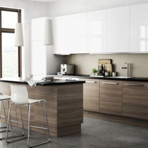 a minimalist ktichen with white uppers and natural wood cabinets and a matching kitchen island and a neutral backsplash