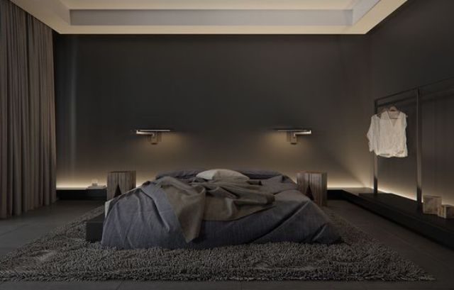 a modern masculine bedroom with a large bed and all black and graphite grey, additional lights make it brighter