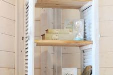 24 window shutters turned into a comfy shelving unit is great for any farmhouse space