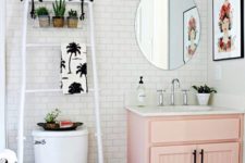 25 a pink vintage cabinet with a white top adds color and a cool look to the powder room