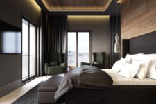 25 a stylish moody bedroom with light wooden floors and a wooden wall and ceiling, a black upholstered bed and black curtains