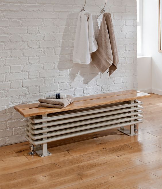 a radiator bench seat is a chic idea to hide it inside your bathroom and make the space usable
