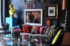 27 to balance a moody feel from the black walls, colorful textiles and artworks were used here, which made the space more contrasting