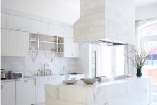 29 a white kitchen is added with a tile clad hood and backsplash and marble surfaces