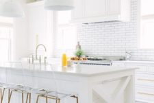 30 a white rustic kitchen with a subway tile backsplash and wooden beams to make it more eye-catching