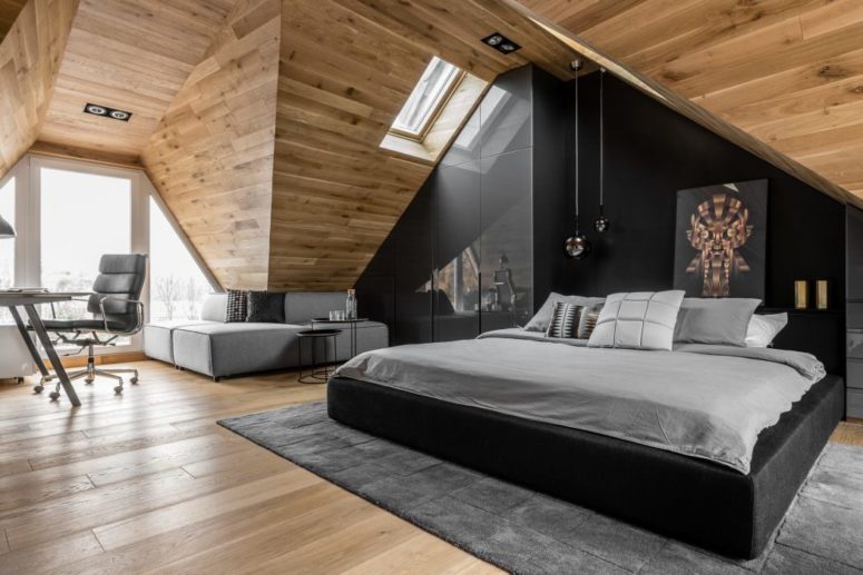 This chic attic space is a masculine bedroom that belongs to a young lawyer, who is a bachelor